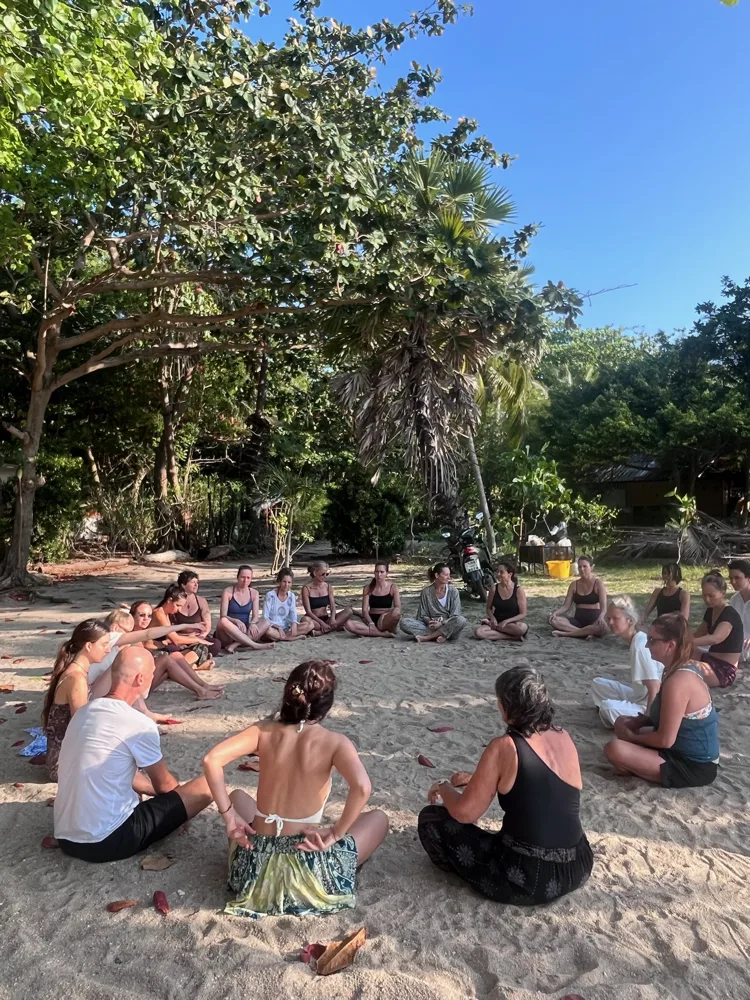 A sharing circle on the sand